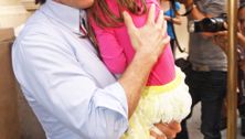 Tom Cruise carries Suri at the indoor playground