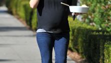 Bump watch: Jennifer Garner multitasks en route to mystery destination