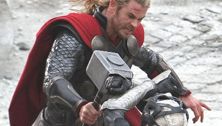 Handsome dad alert: Chris Hemsworth in action on the set of Thor 2