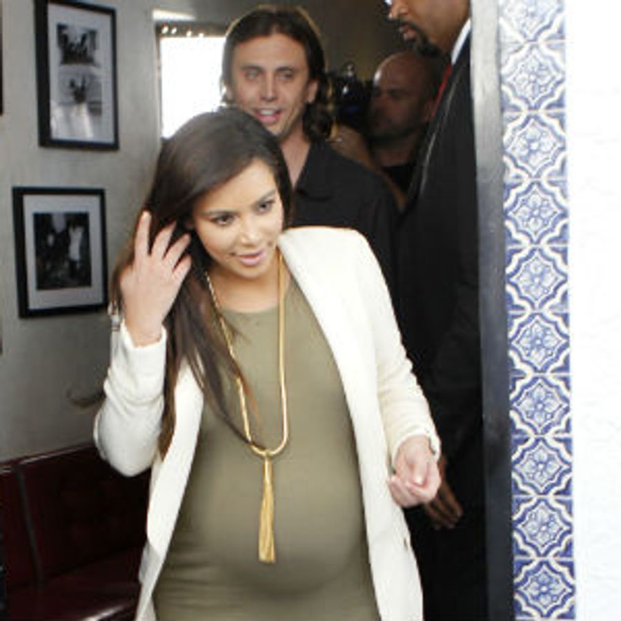 kim kardashian green dress pregnant Pregnant Kim Kardashian hits the wrong style note again in tight dress