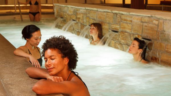 Photo of ladies relaxing in the pools at Body Blitz Spa