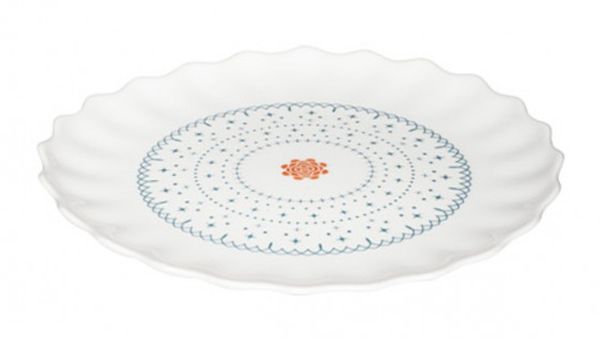 Wg=hite plate with blue design and orange centre