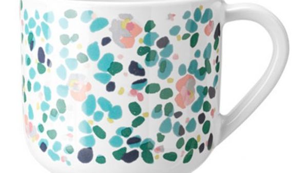 White mug with blue and green dots