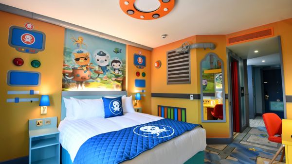 A hotel room with octopi symbols and undersea themes