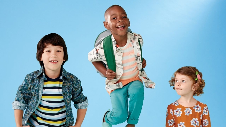 Three kids wearing backpacks