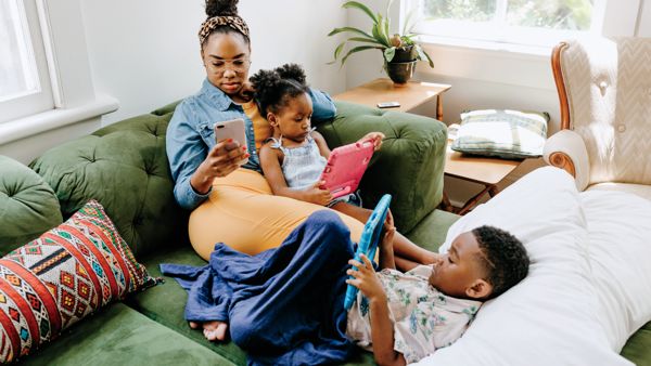 a family gaming together on their devices