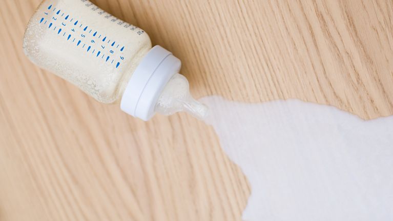 Milk spilling from baby bottle