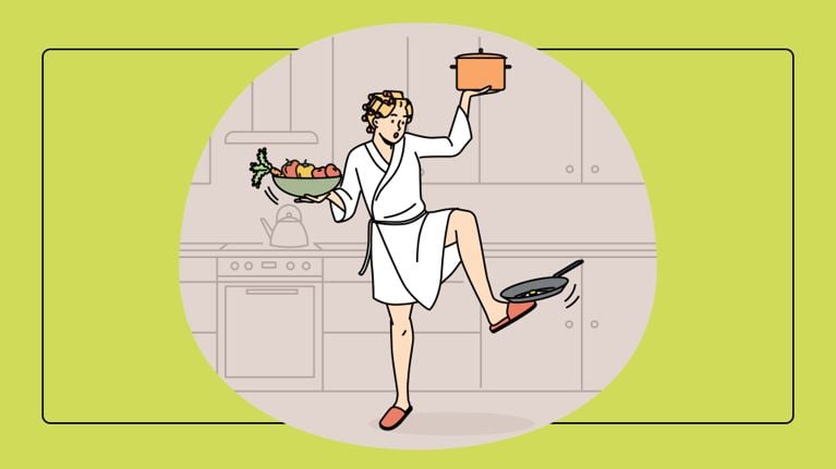 A humorous but relatable illustration of a person in a white bathrobe and hair rollers performing a balancing act. They hold a pot on one hand, a bowl of produce in the other, and balance a frying pan on an upturned foot, set against a kitchen backdrop.