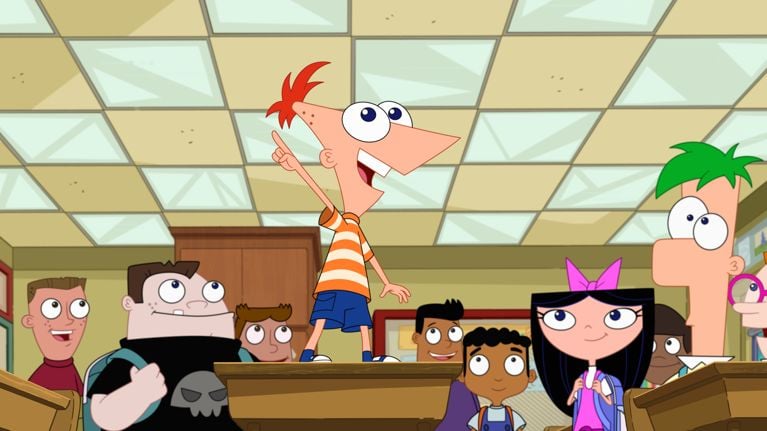 A cartoon boy standing on a desk in a classroom surrounded by other students