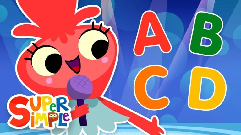 A bright red animated character with large eyes and a microphone sings in front of colorful letters A, B, C, and D. The “Super Simple” logo appears in the corner.