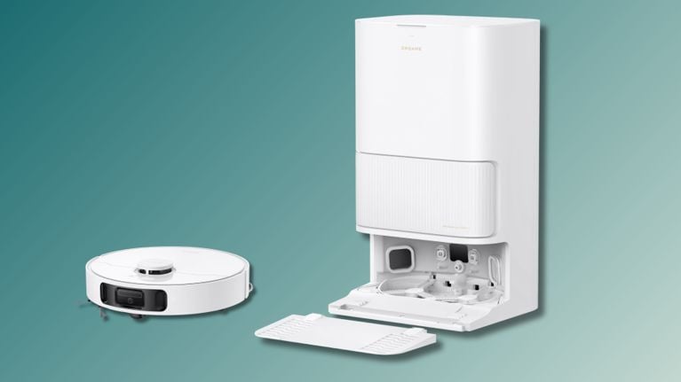 Dreame L40s Ultra CE robot vacuum next to its open base station, displaying the internal mop washing components and removable cleaning pad tray.