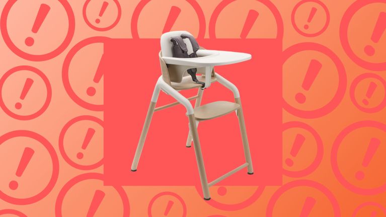 A modern Bugaboo Giraffe high chair with white framing and wood accents is shown against a bright warning icon background; this product has been recalled by Health Canada due to potential fall and injury risks.