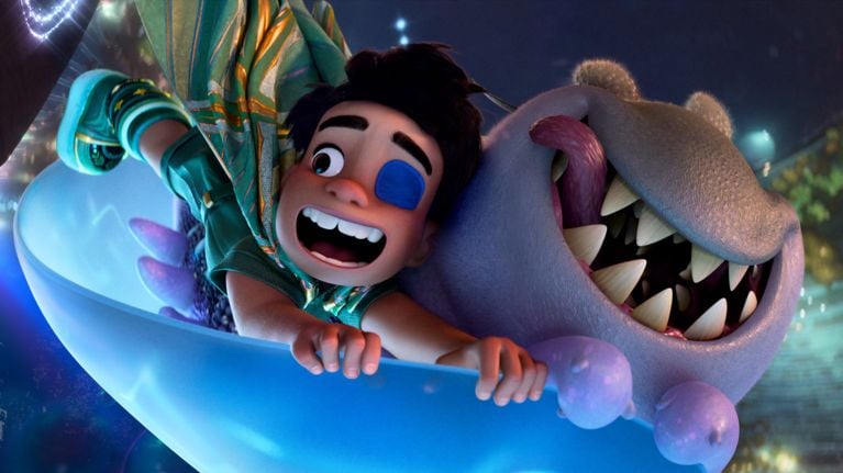 A still from the Disney/Pixar film Elio showing the main character and a purple alien