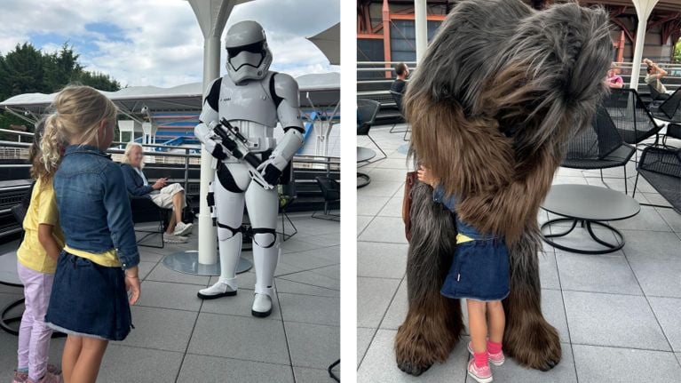 Side-by-side photos of two young girls meeting Star Wars characters at Disneyland Paris—one photo shows them facing a Stormtrooper, the other shows one girl hugging Chewbacca.
