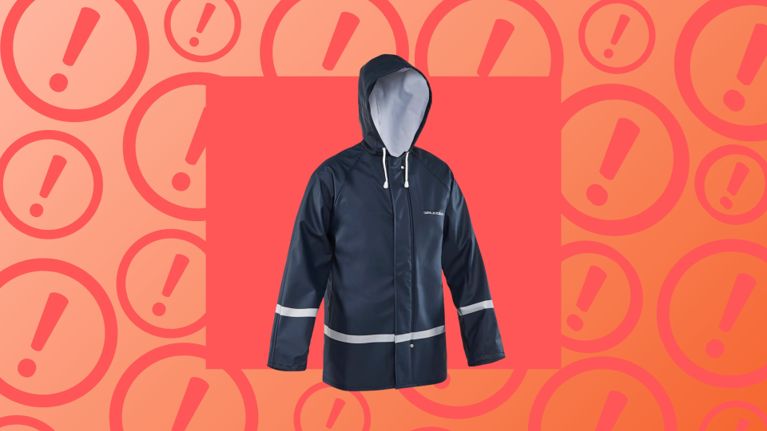 A navy blue Grundens children’s rain jacket with reflective stripes and a hood, shown against a red background with exclamation marks to highlight a Canada-wide recall due to a strangulation hazard from drawstrings.