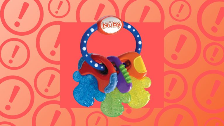 Nuby IceBite keys teething toy with colorful textured keys attached to a blue ring, shown on an orange background with warning icons.