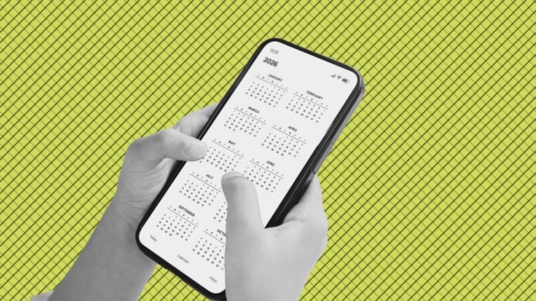 Hands holding a smartphone displaying a full-year calendar, set against a bright green patterned background.