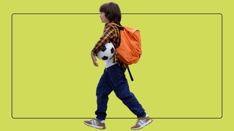 A young boy in a plaid shirt walks with an orange backpack and a soccer ball against a lime green background.