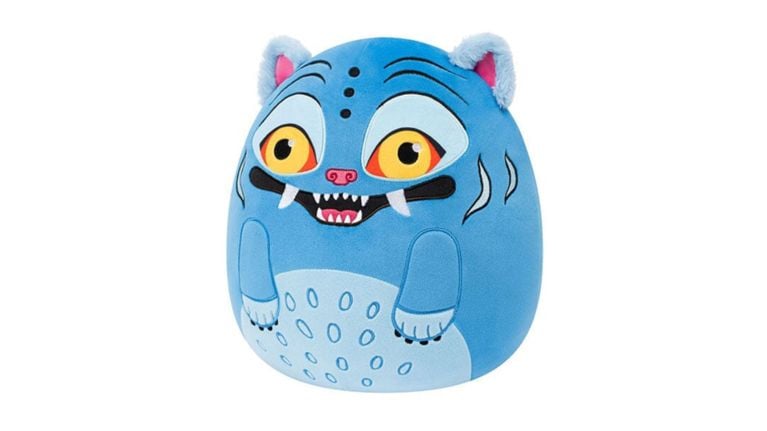 A blue Derpy Tiger Squishmallow from the K-Pop Demon Hunters series with yellow eyes and fangs.