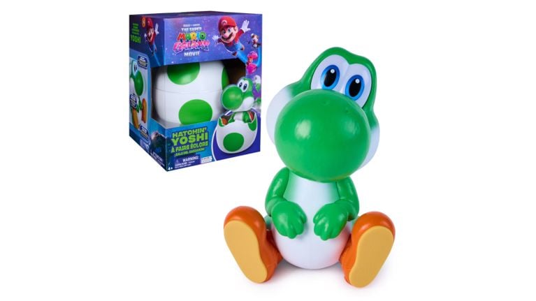Hatchin’ Yoshi interactive toy sitting next to its spotted green and white egg packaging.