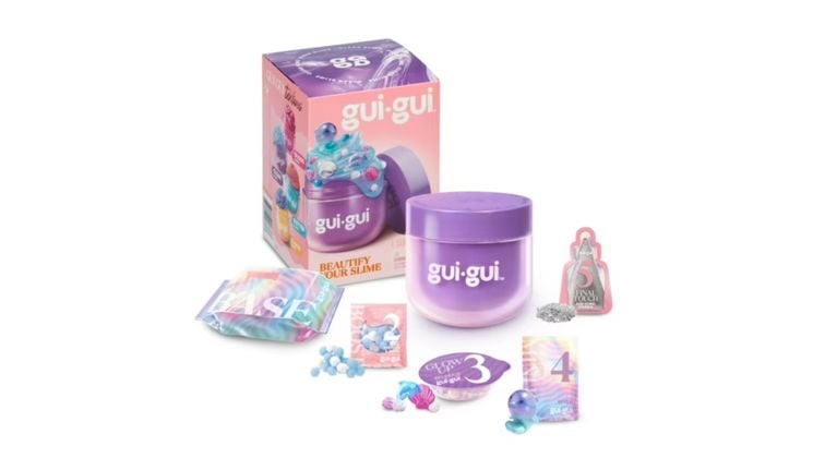 Gui·Gui Beautify Your Slime kit showing a purple container with ocean-themed charms and glitter packets.