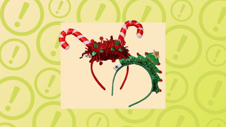 Two festive Christmas headbands, one with red tinsel and candy canes, the other a green tinsel Christmas tree.