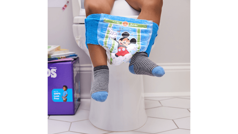 Close-up of a toddler wearing Huggies Pull-Ups Mickey Mouse training pants.