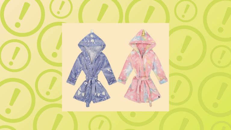 Two Deux par Deux children's glow-in-the-dark plush bathrobes shown against a background of yellow exclamation warning icons.