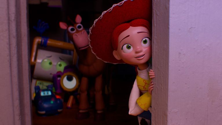 Jessie peeks around a doorway with a smile while several toys gather behind her in a dim room in a scene from Toy Story 5.
