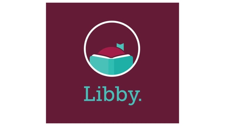 Libby app logo featuring an open turquoise book and the word “Libby” on a dark burgundy background.