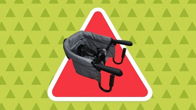 A portable hook on baby chair in a red triangle.