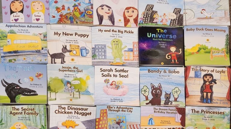 Colorful display of children’s illustrated book covers arranged in a grid, featuring hand-drawn characters, animals, space scenes and adventure stories created by elementary school students.