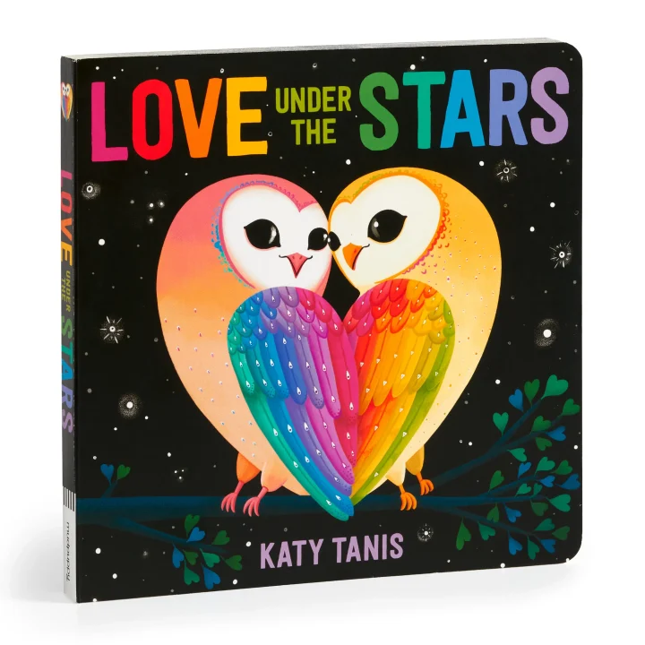 Cover of Love Under the Stars by Katy Tanis, featuring two barn owls perched on a branch, forming a heart shape with their rainbow-colored wings against a starry black sky.