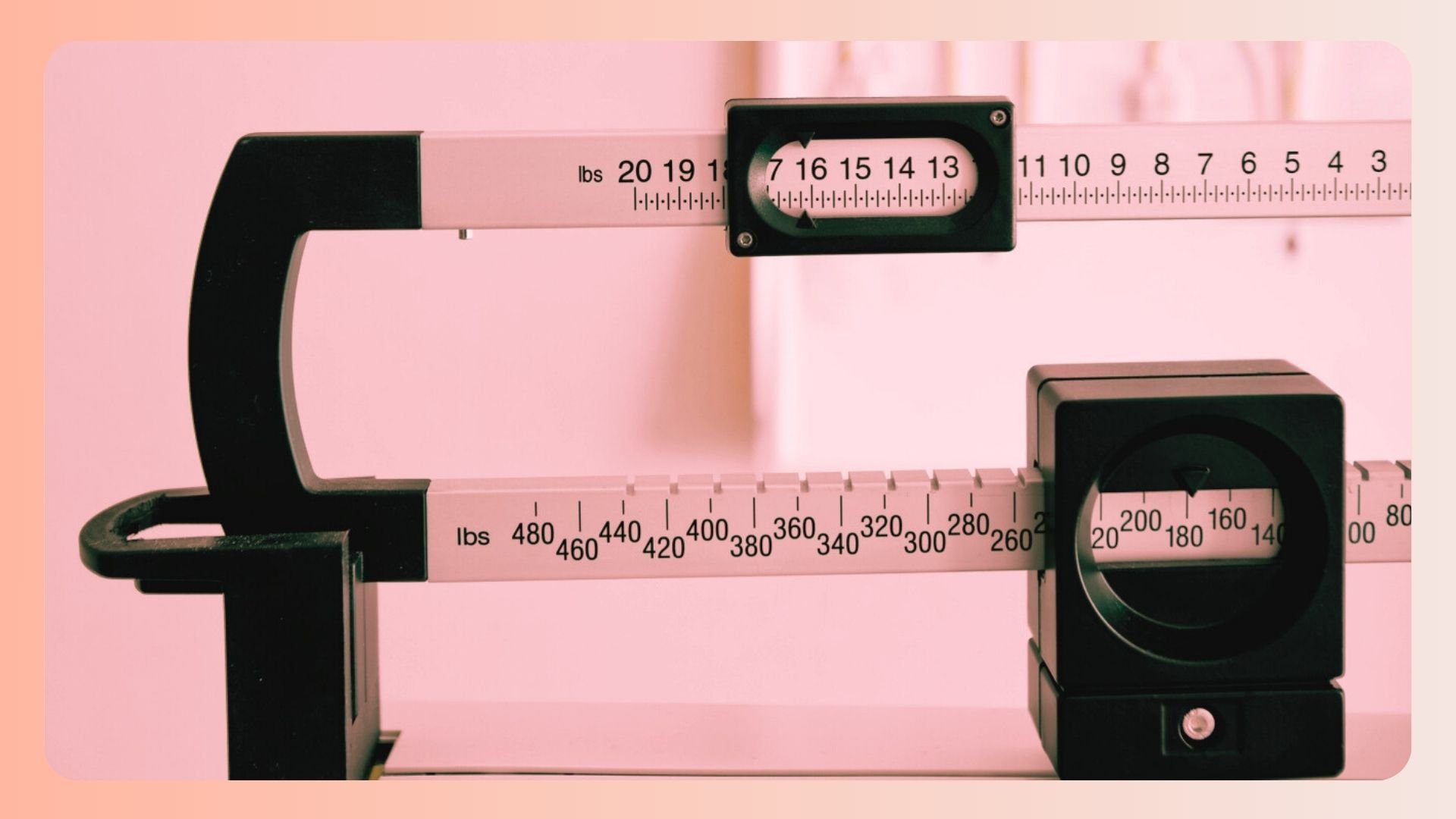 A close-up of a medical scale with a pink overlay.