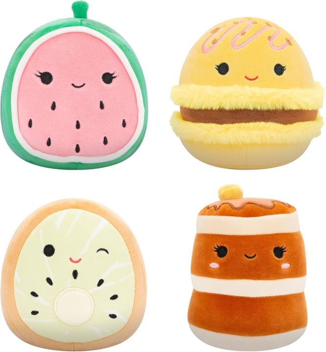 Alt text: Four plush toys shaped like smiling foods, including a watermelon slice, macaron, kiwi and pancakes.